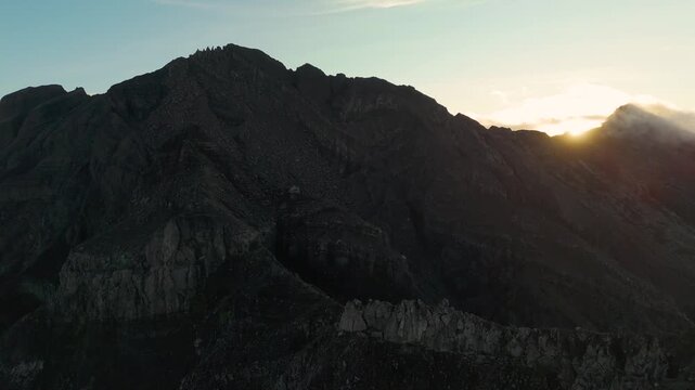 4K drone footage of Mount Raung at sunrise, revealing steep ridges, misty forests, and one of Indonesia&rsquo;s most extreme hiking trails with cloud and vulcano 