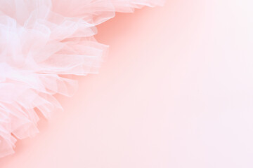 Soft pink background with delicate  tulle and copy space