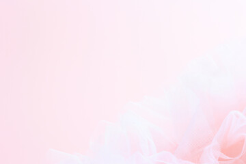 Light pink fabric gently drapes, soft hues background with copy space