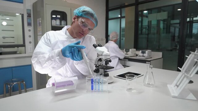 Person conducts experiments in laboratory space with detailed equipment and technology