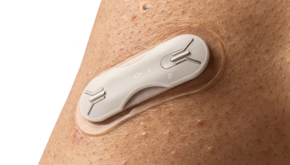 Closeup of a sleek wearable sensor patch adhered to upper torso skin designed to monitor postsurgical healing with advanced biometric tracking technology on a white background.