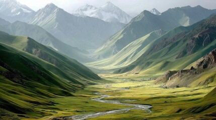 A breathtaking landscape featuring rolling green hills, a winding river, and majestic mountains under a soft, cloudy sky.