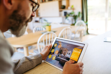 Man using smart home control panel.