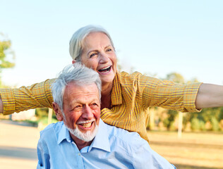 Happy active senior couple having fun outdoors. Portrait of an elderly couple together