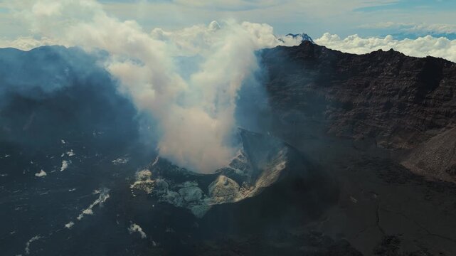 4K drone footage of Mount Raung at sunrise, revealing steep ridges, misty forests, and one of Indonesia&rsquo;s most extreme hiking trails with cloud and vulcano 