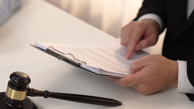 Client rely on law firm to provide legal counsel and advice with lawyers or attorney review, analyze complex legal contract document as trusted corporate law consultation service. Slow motion. Rigid.