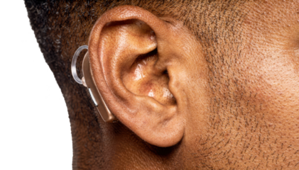 Isolated image of a hearing aid inserted in an adults ear with darker skin tone highlighting tinnitus management solution against a white background.