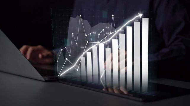 A modern workspace features a digital screen displaying financial charts and data analysis representing growth trends and successful business strategies. Copula