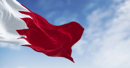 Bahrain flag waving on a clear day