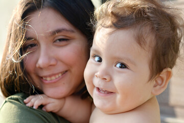 Latin baby with big sister.