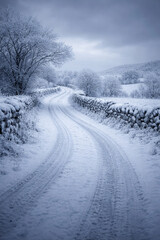 Snow-covered country road in winter