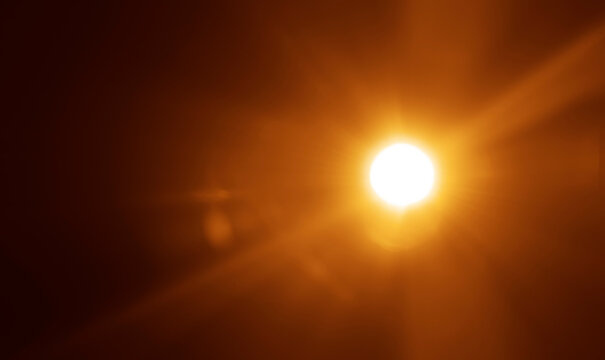 shiny sun rays burst, sunbeams, sunrays, sunshine sunburst design. Yellow warm light effect, sunny beams, yellow orange red golden sunshine isolated on black background. star dust sun light shine