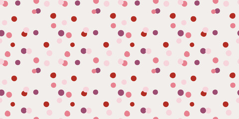 Seamless polka dot pattern with scattered circles in red and pink. Background with dots. Banner