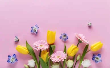 Fotobehang Muziek Beautiful banner with spring flowers on pastel pink table top view. Greeting card for International Women Day or Mother day. Flat lay.  © juliasudnitskaya