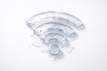 An icy wireless internet sign melting against a light background.