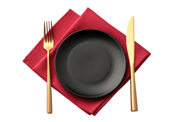 Elegant table setting with gold cutlery and red napkin