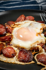 Fried egg and sliced sausage.