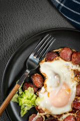 Fried egg and sliced sausage.