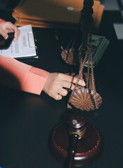 Consultation and conference of professional businesswoman and Male lawyers working and discussion having at law firm in office. Concepts of law, Judge gavel with scales of justice