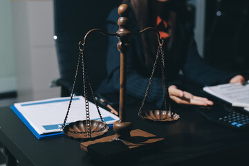 Consultation and conference of professional businesswoman and Male lawyers working and discussion having at law firm in office. Concepts of law, Judge gavel with scales of justice