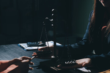 Consultation and conference of professional businesswoman and Male lawyers working and discussion having at law firm in office. Concepts of law, Judge gavel with scales of justice