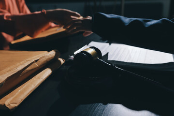 Consultation and conference of professional businesswoman and Male lawyers working and discussion having at law firm in office. Concepts of law, Judge gavel with scales of justice