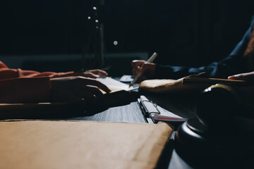 Consultation and conference of professional businesswoman and Male lawyers working and discussion having at law firm in office. Concepts of law, Judge gavel with scales of justice