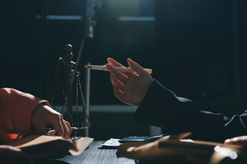 Consultation and conference of professional businesswoman and Male lawyers working and discussion having at law firm in office. Concepts of law, Judge gavel with scales of justice