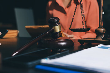 Consultation and conference of professional businesswoman and Male lawyers working and discussion having at law firm in office. Concepts of law, Judge gavel with scales of justice