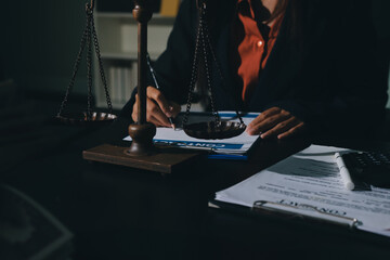 Consultation and conference of professional businesswoman and Male lawyers working and discussion having at law firm in office. Concepts of law, Judge gavel with scales of justice