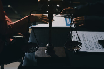 Consultation and conference of professional businesswoman and Male lawyers working and discussion having at law firm in office. Concepts of law, Judge gavel with scales of justice