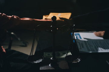 Consultation and conference of professional businesswoman and Male lawyers working and discussion having at law firm in office. Concepts of law, Judge gavel with scales of justice