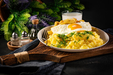 Fried eggs with boiled potatoes and yellow string beans.