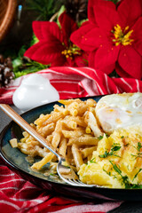 Fried eggs with boiled potatoes and yellow string beans.