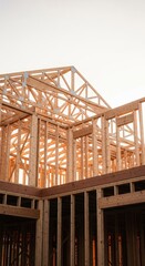 Fototapeta premium Framing stage view of a new single-family residence being built. Structural lumber, beams, and trusses create the skeleton of the house, renovation, industry, home