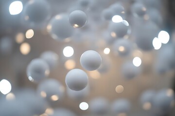 White spheres floating in soft focus with glowing lights