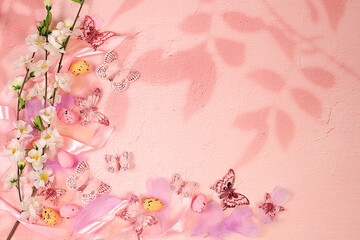 Beautiful Easter banner with decorated quail eggs, sakura and cherry blossom branches, spring butterflies, and feathers. Happy Easter concept. Abstract spring Easter composition with space for text