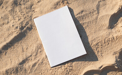 blank magazine mockup on sandy beach © dark_blade