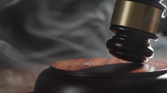 Dramatic Judge's Gavel Hitting Sound Block with Atmospheric Smoke and Light
