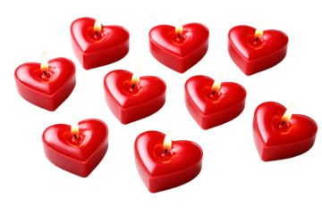 Red heart-shaped candles on transparent background. Romantic decor. Valentine’s Day atmosphere.