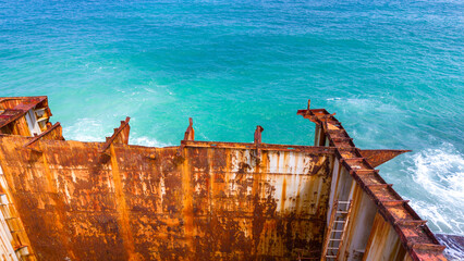 Rusty Shipwreck on Turquoise Sea