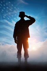 Silhouette of male soldier saluting with american flag at sunset