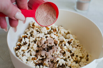 Protein popcorn in a bowl on a wooden background