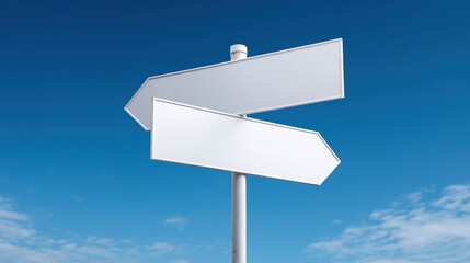 Two blank white road signs pointing in opposite directions against blue sky