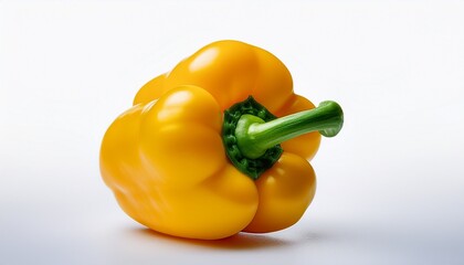 a single fresh yellow bell pepper with a bright green stem isolated against a white background