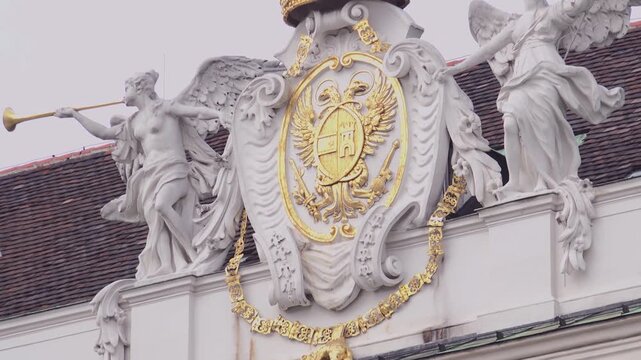 Statues and emblems on the roofs of the Hofburg Palace