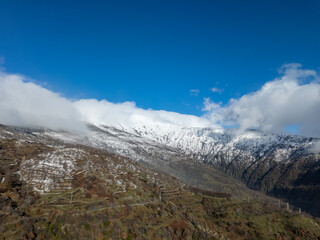 Snowy mountain peak with terraced slopes in Odemis, Turkiye