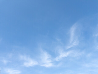 Wispy white clouds in bright blue sky above Hokkaido, Japan in spring