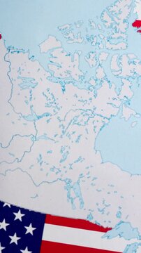 American flags and dollars appearing on a map of Greenland, illustrating the geopolitical concept of the USA purchasing the autonomous Danish territory for strategic and economic advantage