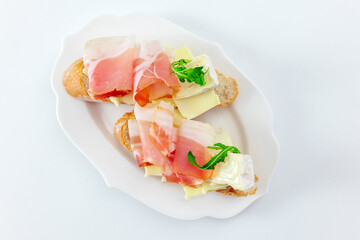 Delicious bread with slices of meat and cheese